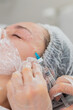 © Andrii Iemelianenko - Beauty anti-aging injections biorevitalization face mesotherapy. Cosmetologist doctor making needle hyaluronic injections syringe into skin of young woman girl. Lifting procedure therapy in clinic