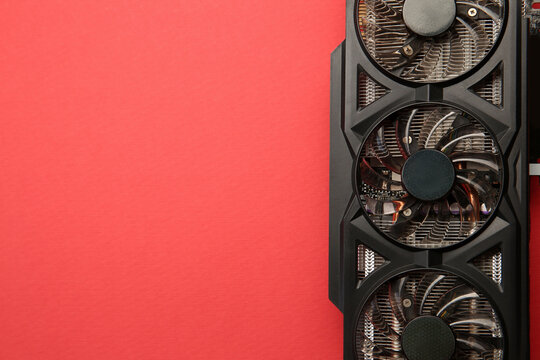 One graphics card on red background, top view. Space for text