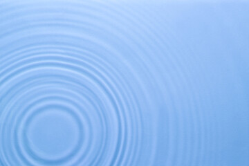 Wall Mural - Rippled surface of clear water on light blue background, top view
