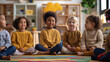 © Pro Hi-Res - Diverse group of young children sit together in classroom.