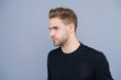 © be free - Man with trendy hairstyle. Casual male style. Young Caucasian man isolated on grey. Confident man face portrait. Men skin care. Skincare of men. Guy has stylish haircut. Facial care