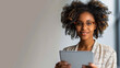 © Bartek - Confident African American Businesswoman Using Digital Tablet in Modern Office During Daytime