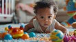 © basketman23 - Cute mixed race baby playing with toys,  exploring the world with curiosity