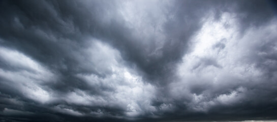 Aufkleber - Bad or moody weather sky and environment. climate change. carbon dioxide emissions, greenhouse effect, global warming.The dark sky with heavy clouds converging and a violent storm before the rain.