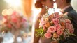 © Lubos Chlubny - Focus on a beautiful wedding bouquet with a newlywed couple sharing a kiss in the background