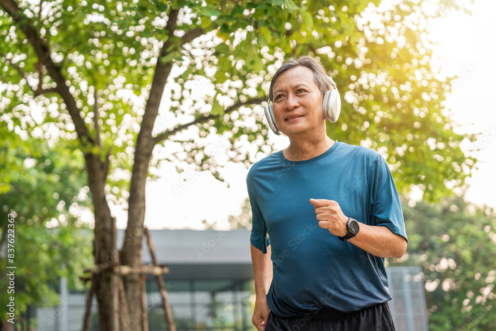 Senior old man runner exercise outdoor nature park. fitness man jogging wearing sportswear. Mature athlete man in sportswear Workout running at public park. Health and activity old man lifestyle