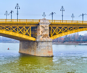 Wall Mural - The statue of Ancient God on the stone pillars of Margaret Bridge, Budapest, Hungary