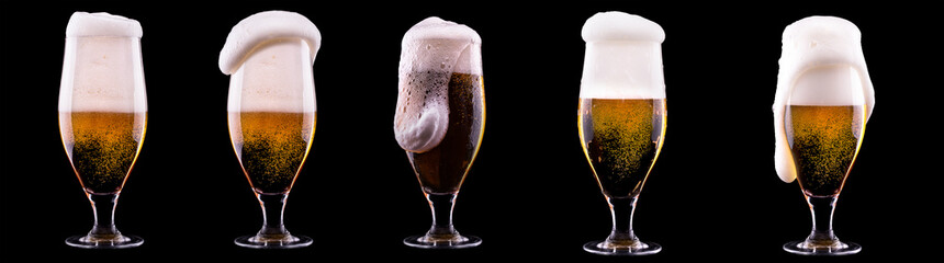 Wall Mural - Frosty glass of light beer on black background