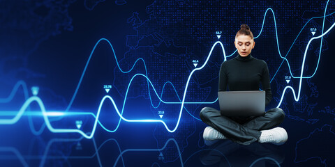 Poster - Attractive young woman sitting on floor and using laptop with growing business graph on dark background. Financial growth and technology concept.