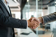 © evening_tao - Professional Business Handshake in Modern Office