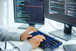 © weedezign - close up  developer hand coding with keyboard on desk  at modern office