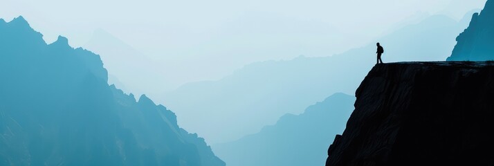 Wall Mural - Silhouette of Person Standing on Mountain Edge