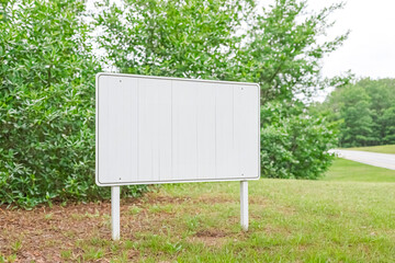 Blank White Sign in a Grassy Area