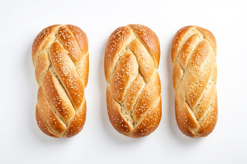 Canvas Print - Three Braided Bread Rolls with Sesame Seeds