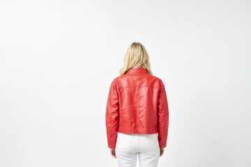 Wall Mural - Woman in red leather jacket standing with her back to the camera