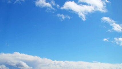 Wall Mural - Summer sky with white, cumulus clouds. Background with empty space for titles. Clouds frame copy space.