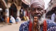 © Hryhor Denys - A Muslim man with a beard is wearing a red beaded necklace