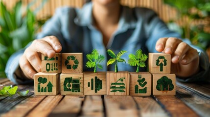 A businessman surrounded by cascading wooden blocks with green eco friendly icons.