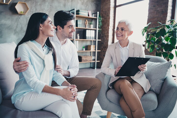 Poster - Portrait of young married couple cuddle sit couch consultation visit psychotherapist loft interior office indoors