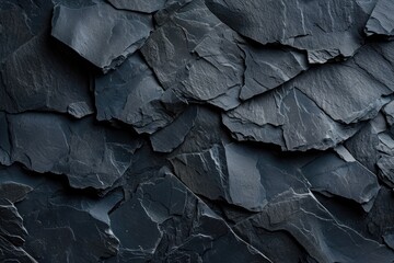 Wall Mural - A close-up view of a dark-colored rock wall with textured surface