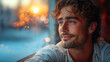 © bluecreamy - Happiness, a beautiful young man smiling warmly, looking out a window with a beautiful sunset in the background. with a sense of contentment and happiness, the dreamy golden bokeh effect