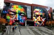 © keiron - Vibrant geometric mural transforms city building facade with bold colors, contemporary art