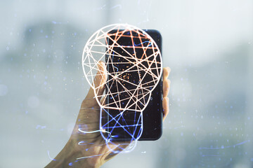 Poster - Double exposure of creative light bulb hologram and hand with cell phone on background, research and development concept