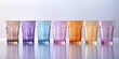 © Da - Row of ceramic water glasses of different colors, simple bright background, summer, decoration, fashion item, marketing background, uniqueness, individual independent existence, multi-ethnic culture,