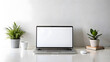 © Daria - Mockup Laptop with blank screen on home office desk. Minimal workspace with blank computer screen mockup on white background