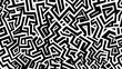 © Kittipong - A complex abstract pattern with an interlocking maze of lines in black and white