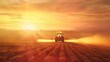 © Tatiana - A farmer rides in a combine and waters his fields, agricultural business concept