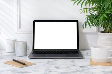 Poster - Office workplace with computer, glasses, cup and stationery on marble table near white wall