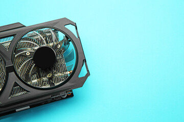 Poster - One graphics card on light blue background, top view. Space for text