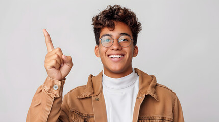 Wall Mural - young hispanic man wearing casual clothes and glasses pointing finger up with successful idea. exited and happy. number one isolated on white background, professional photography, png