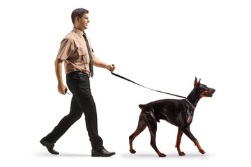 Poster - Security officer walking with a doberman dog on a leash