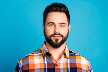 Wall Mural - Photo of nice young man calm face wear shirt isolated on blue color background