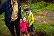 © Marko Geber - Grandfather walking with grandchildren and their mother in the forest