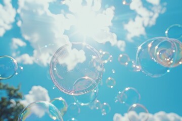 Wall Mural - Soap bubbles fly against the blue sky on a sunny day
