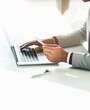 © peopleimages.com - Businessman, hands and credit card with laptop for payment, online shopping and banking investment. Fintech, professional trader and digital finance with typing, loan application and budget in office