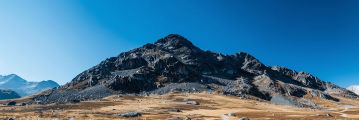 Wall Mural - Dramatic and Majestic Mountainous Landscape with Crisp Clear Blue Sky and Ample Copy Space for Advertising or Design Purposes