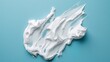 © Bi - White cream smear on a blue background