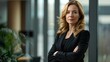 © Lipy - An inside office portrait of a wealthy businesswoman, standing with her arms crossed, Generative AI.
