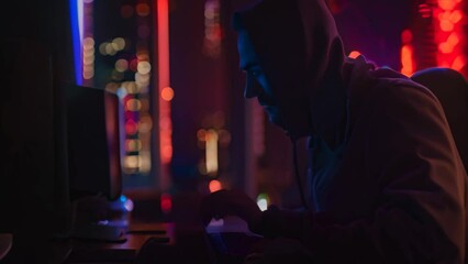 Poster - A man wearing a hooded sweatshirt is actively using a computer for social engineering training, A social engineering expert training employees to recognize phishing attempts
