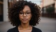 © Sanan - Portrait of a beautiful young african american woman in eyeglasses outdoors. ai generative