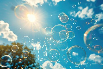 Wall Mural - Soap bubbles fly against the blue sky on a sunny day