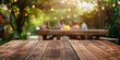 © KEA - Empty wooden table and blurred view of people having BBQ barbecue with modern grill outdoors
