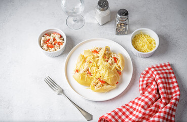 Wall Mural - Conchiglie pasta with minced chicken, red pepper and ricotta cheese in a plate