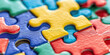 © IndigoElf - Closeup of multicolored Puzzle pieces. Abstract background, concept of logic, teamwork and problem solving