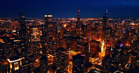 Canvas Print - Dazzling illumination of modern American metropolis at night. Scenic view of Chicago, Illinois, United States from top.