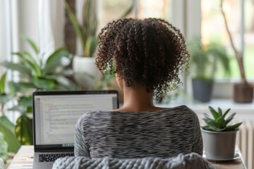 Canvas Print - Woman seated, using laptop